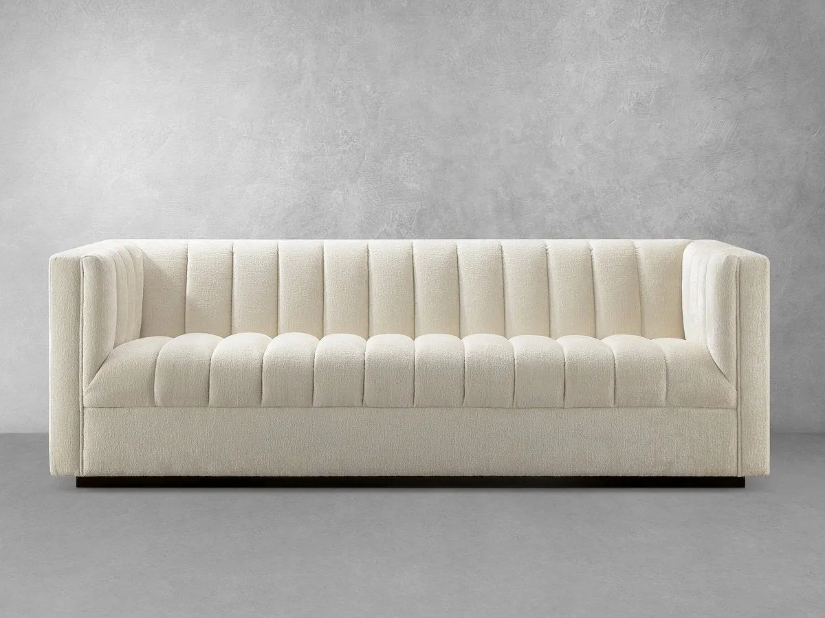 Lavish Upholstered Fabric Channel Sofa